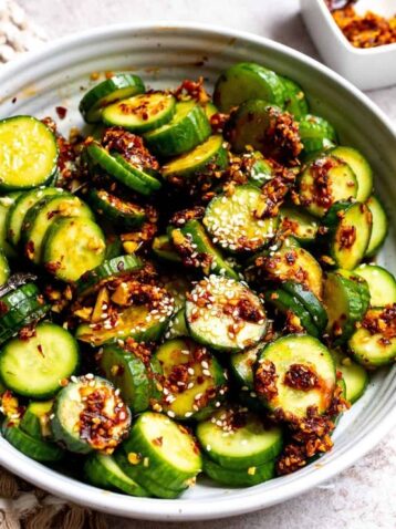 Spicy Asian cucumber salad, Easy Asian cucumber salad recipe, Chili oil cucumber salad, Refreshing cucumber salad with Asian flavors, Low-calorie spicy cucumber salad