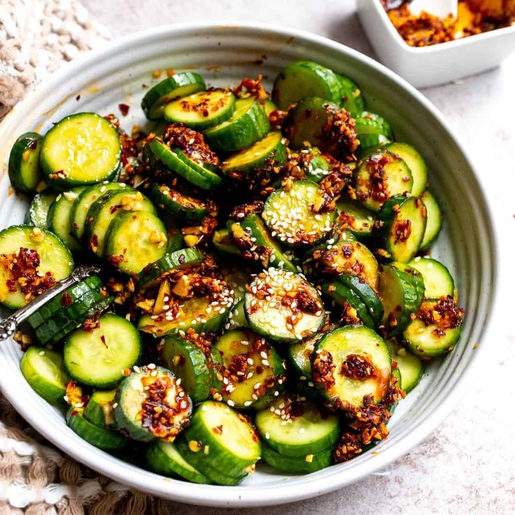 Spicy Asian cucumber salad, Easy Asian cucumber salad recipe, Chili oil cucumber salad, Refreshing cucumber salad with Asian flavors, Low-calorie spicy cucumber salad